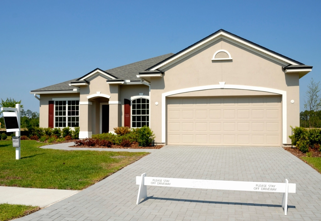 New double garage door installed on a single-story home